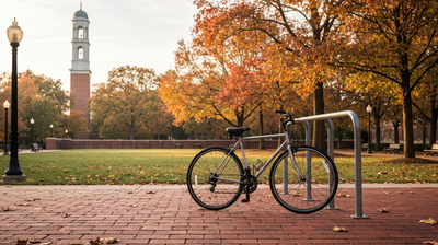 University quad walkway with a bicycle leaning against a rack