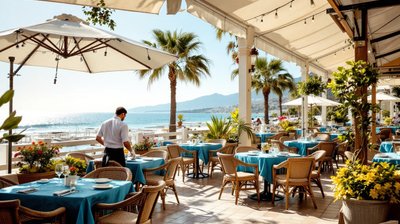 A Cyprus seafront cafe with a waiter setting tables, seen from behind